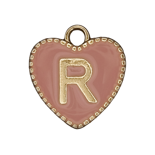 close-up of pink heart charm with gold letter R
