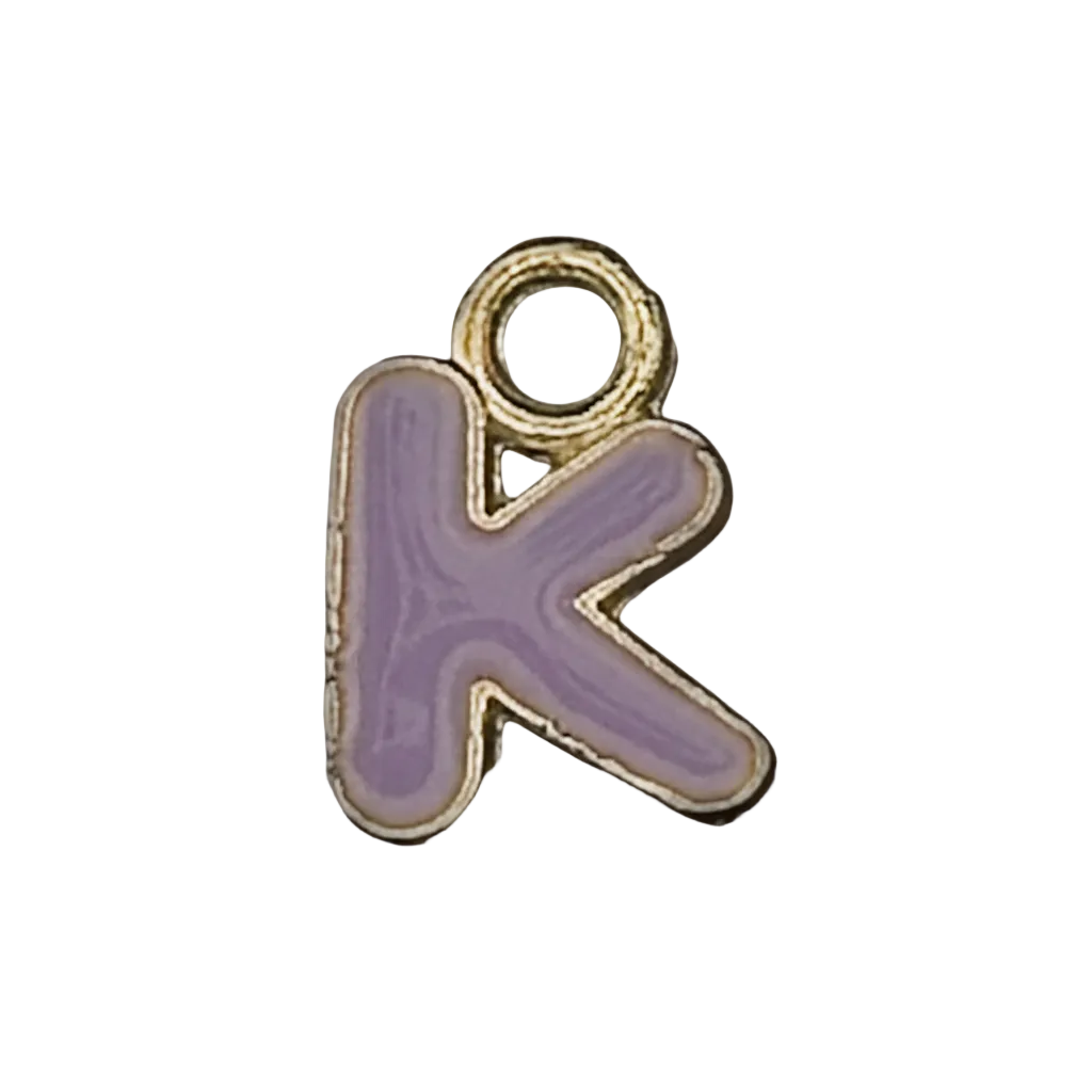 Close-up of purple letter K charm with gold-tone edge on a black background.