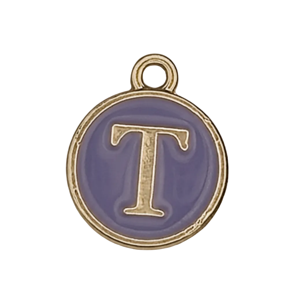 close-up of round purple enamel charm with gold letter T