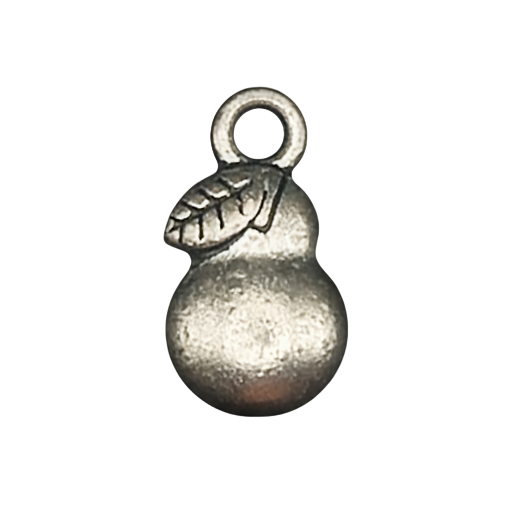 Close-up of a small silver pear charm with a leaf detail on a black background.