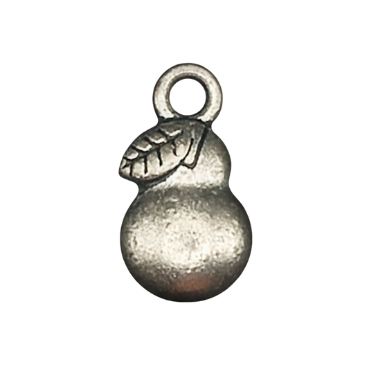 Close-up of a small silver pear charm with a leaf detail on a black background.
