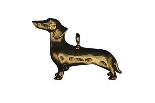 gold dachshund dog charm on black background