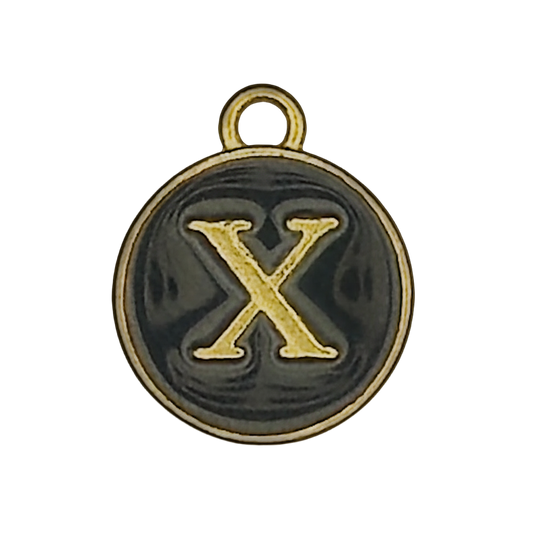 close-up of round black charm with gold letter X and gold rim