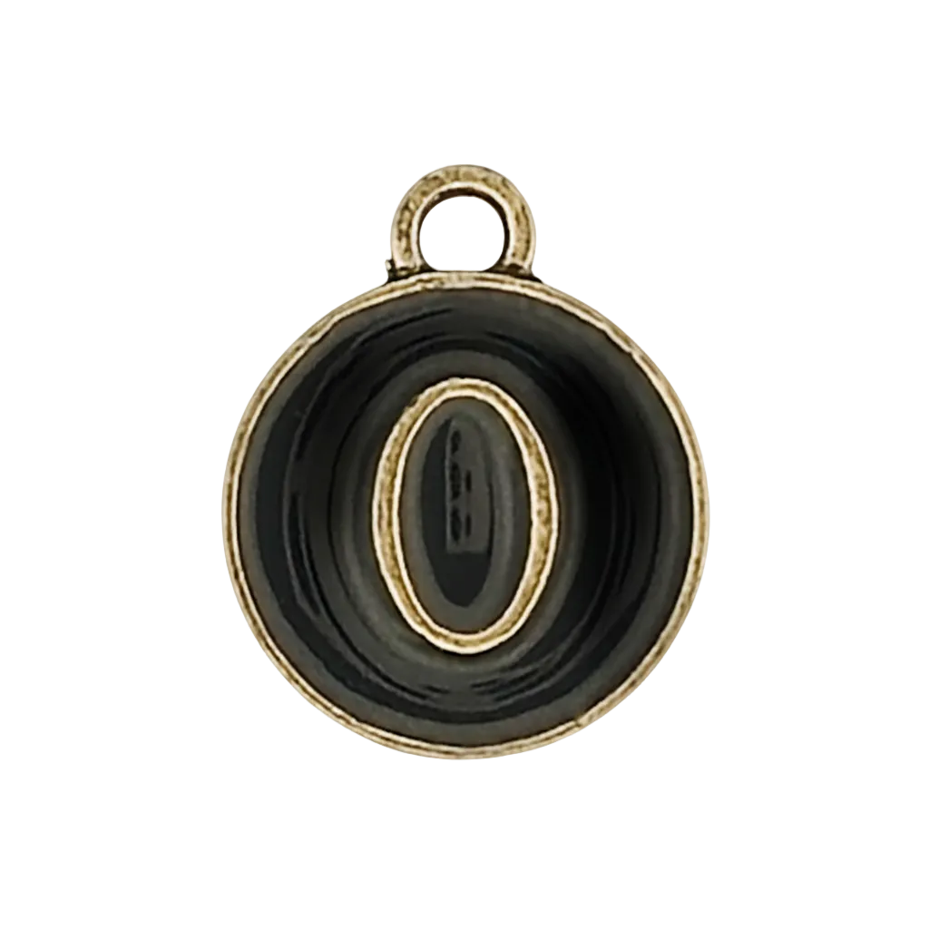 close-up of round black and gold letter O charm