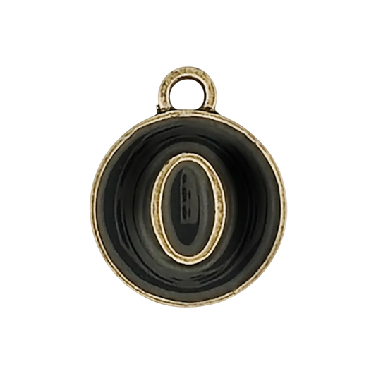 close-up of round black and gold letter O charm