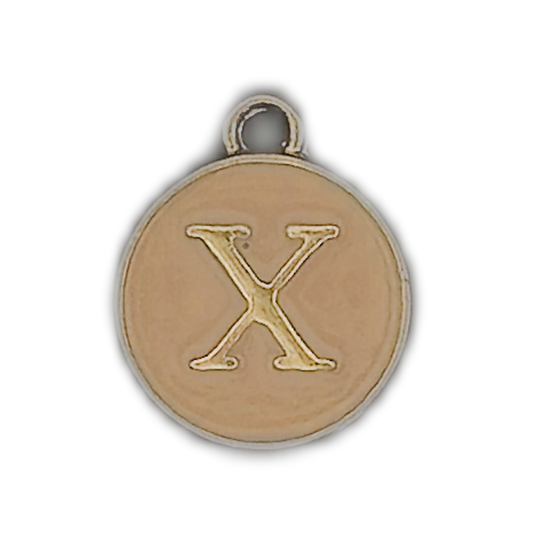 Close-up of a round gold-tone charm with the letter X.