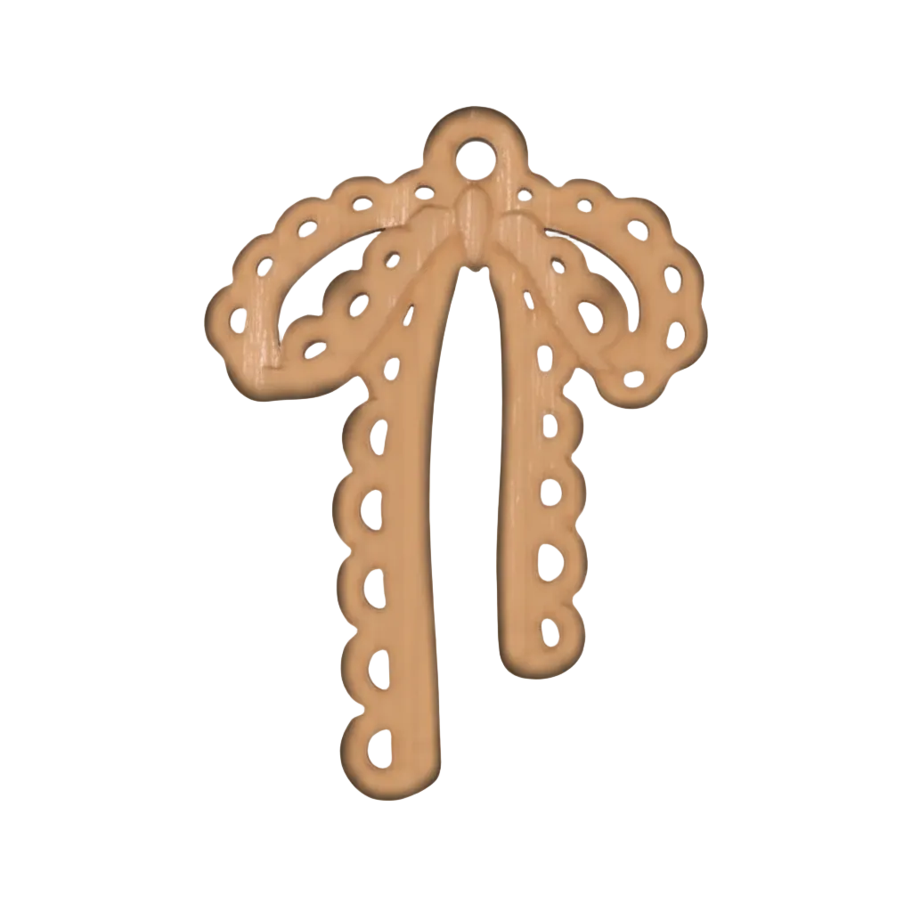 close-up of gold-tone lacy bow charm on black background