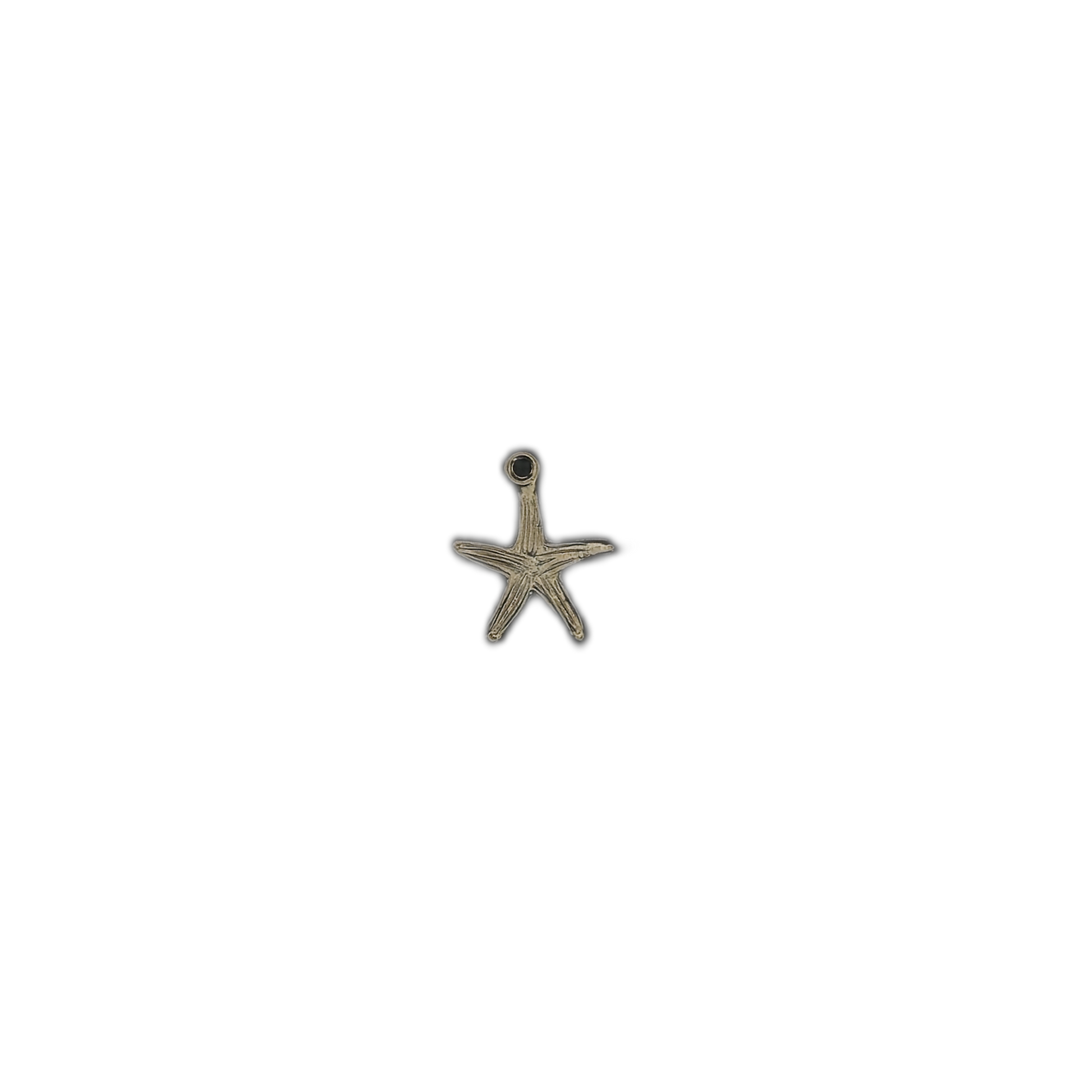small gold-tone starfish charm centered on black background