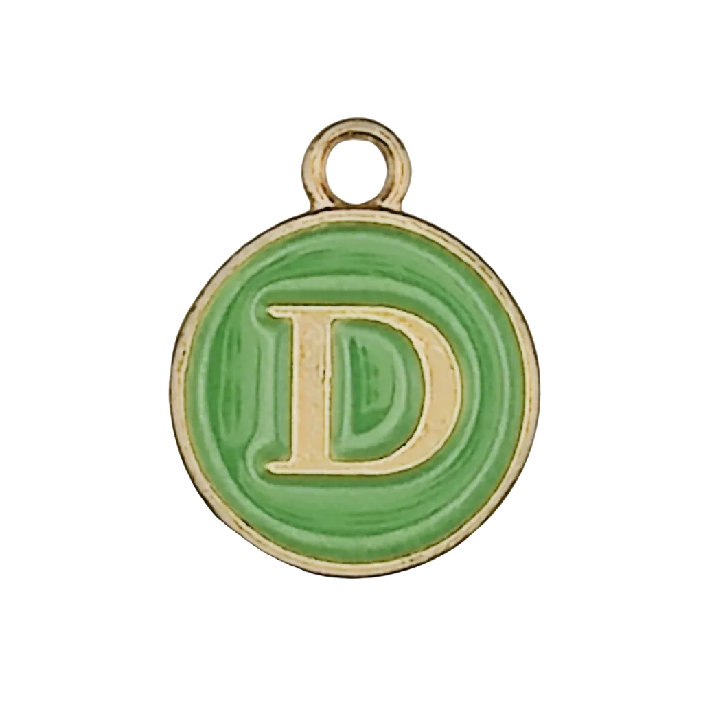 close-up of round green enamel charm with gold letter D