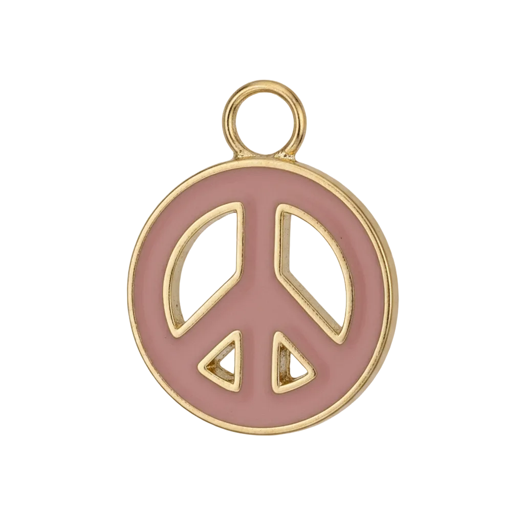 close-up of pink enamel peace sign charm with gold-tone edge on black background