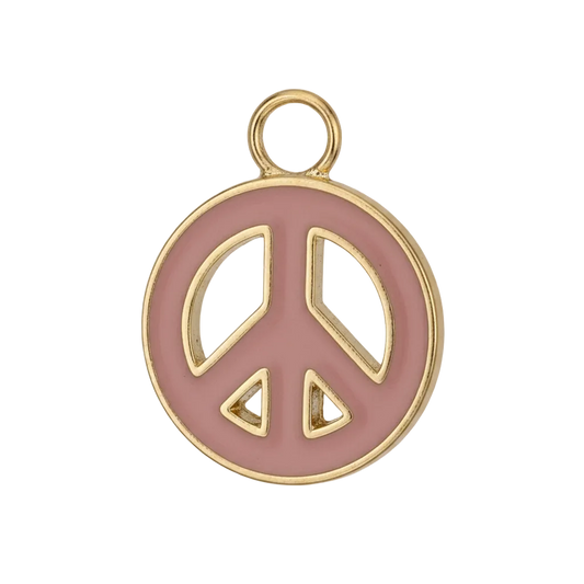 close-up of pink enamel peace sign charm with gold-tone edge on black background