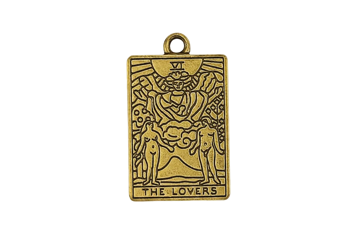 gold rectangular tarot card charm reading The Lovers, close-up on black background