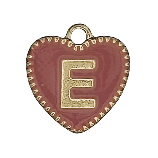 close-up of red heart charm with gold letter E