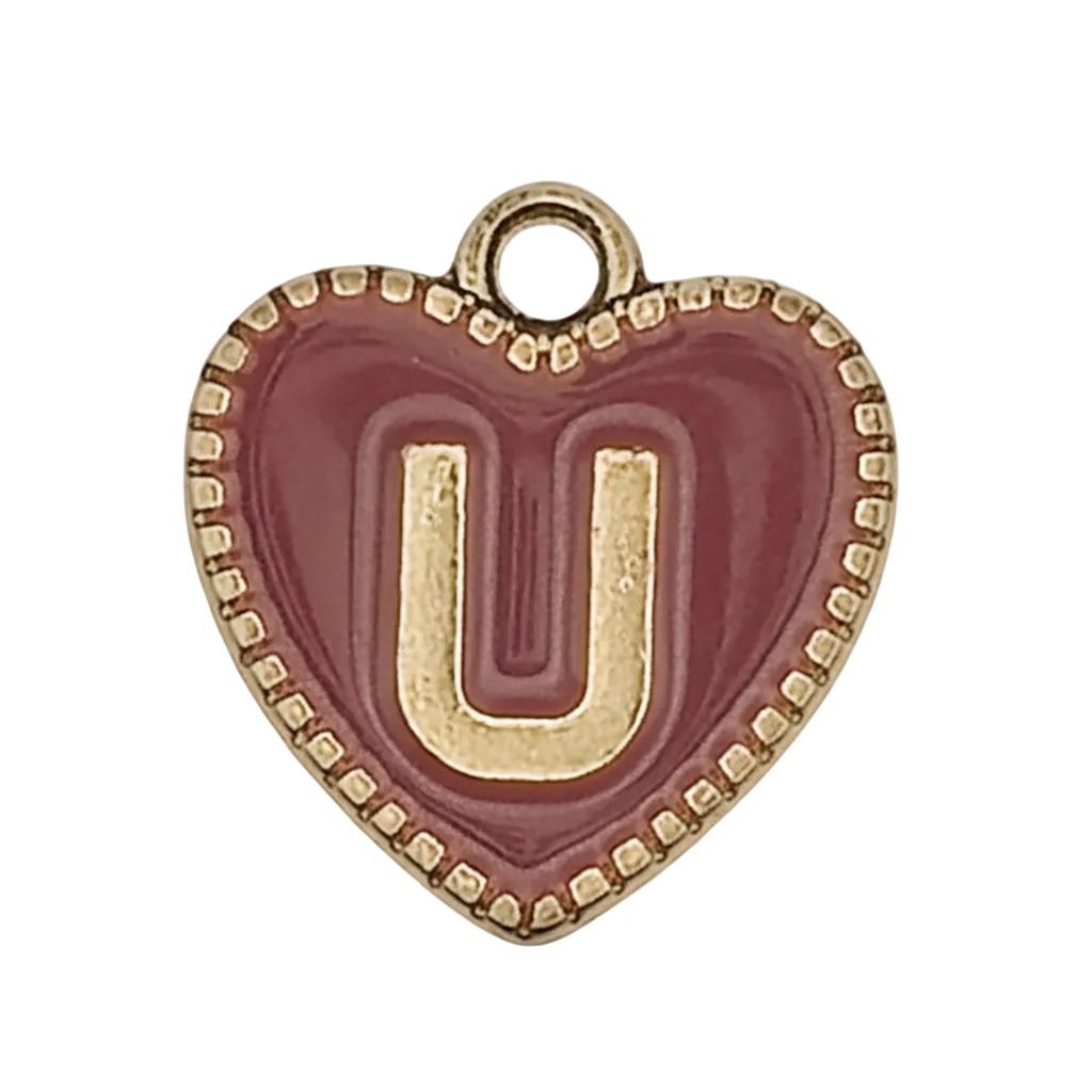 close-up of burgundy heart charm with gold letter U