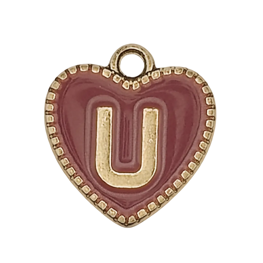 close-up of burgundy heart charm with gold letter U