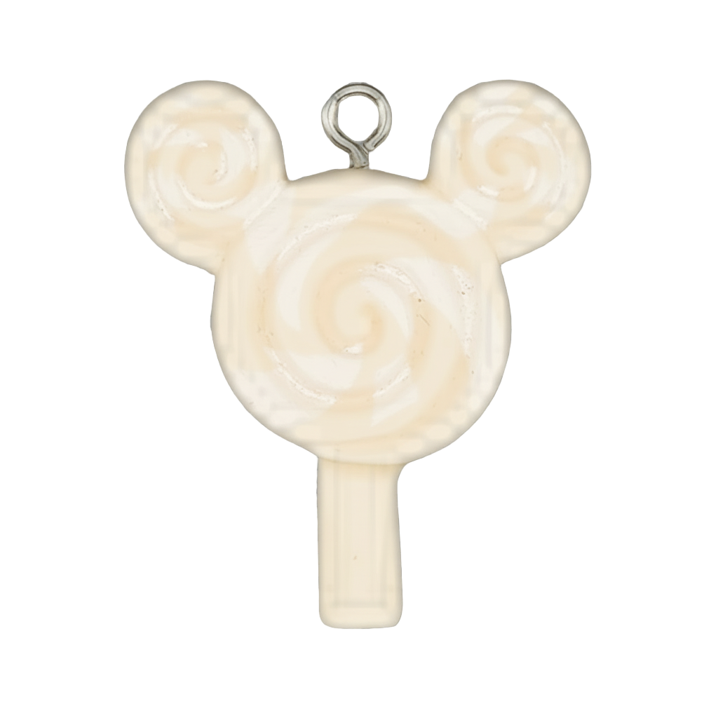 close-up of cream and white swirl lollipop charm with two round ear-like tops on a black background