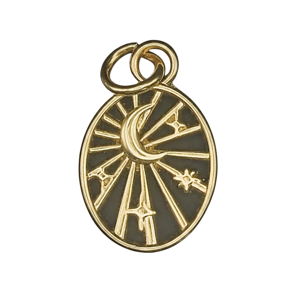 close-up gold oval charm with crescent moon, stars, and rays on a black background