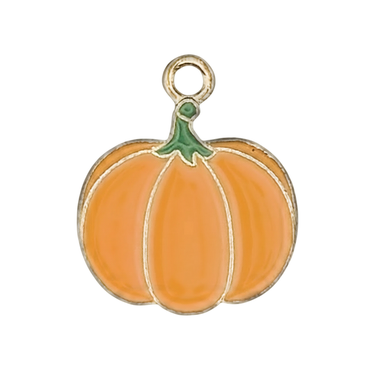 close-up of orange enamel pumpkin charm with green stem and gold-tone outline