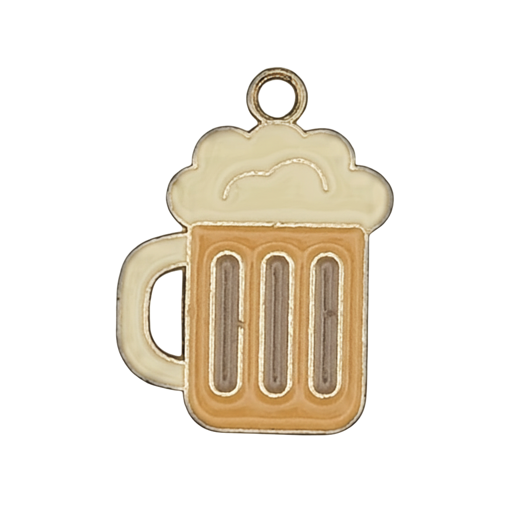 Close-up of a small beer mug charm with foamy top, amber body, and gold outline on a black background.