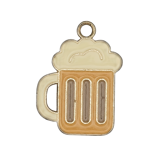 Close-up of a small beer mug charm with foamy top, amber body, and gold outline on a black background.