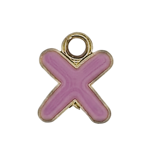 close-up of a pink enamel letter X charm with a gold outline on a black background