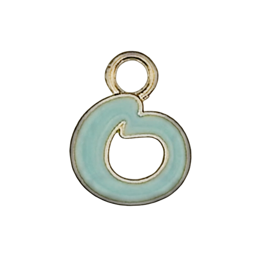 Close-up of a small gold-tone lowercase g charm with light blue enamel on a black background.