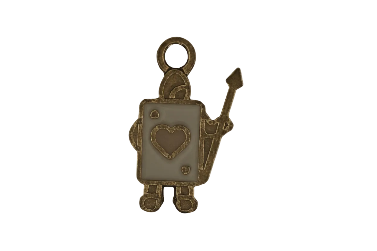 close-up of a gold-tone playing card soldier charm with heart emblem and spear on a black background
