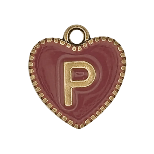 Close-up of burgundy heart charm with gold letter P and dotted gold border.