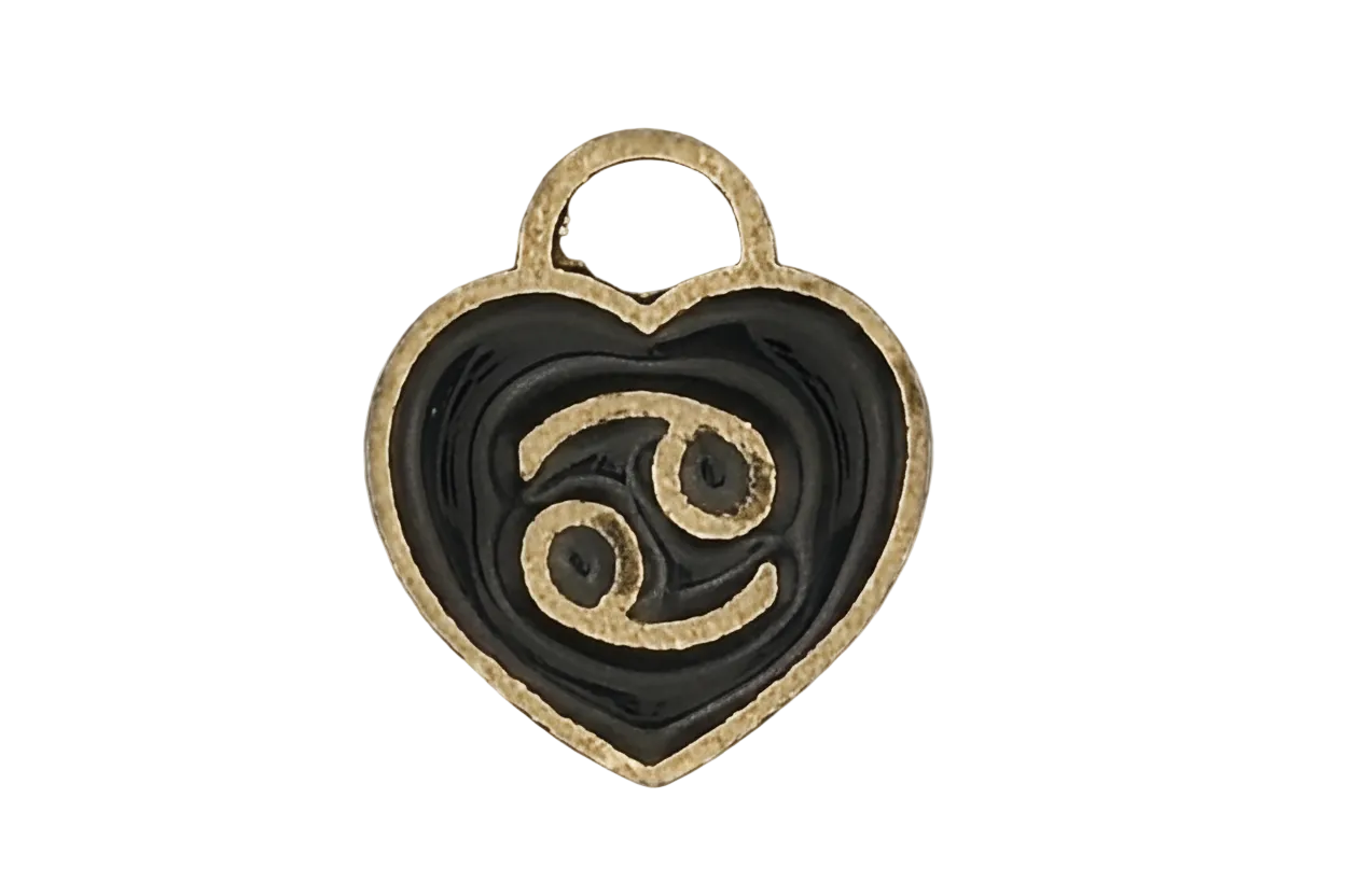 close-up of a black enamel heart charm with a gold Cancer zodiac symbol
