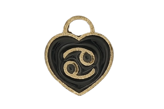 close-up of a black enamel heart charm with a gold Cancer zodiac symbol