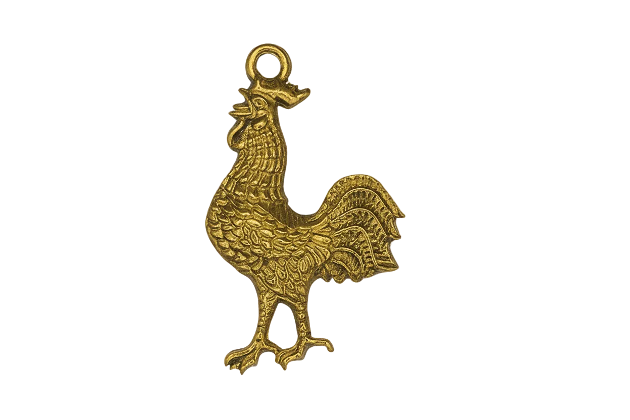 close-up of gold-tone rooster charm on black background