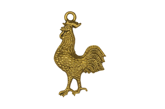 close-up of gold-tone rooster charm on black background