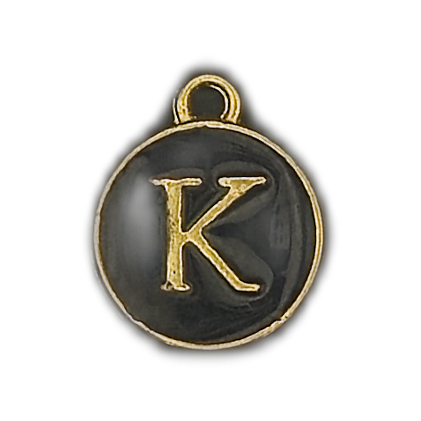 close-up of round black enamel charm with gold letter K