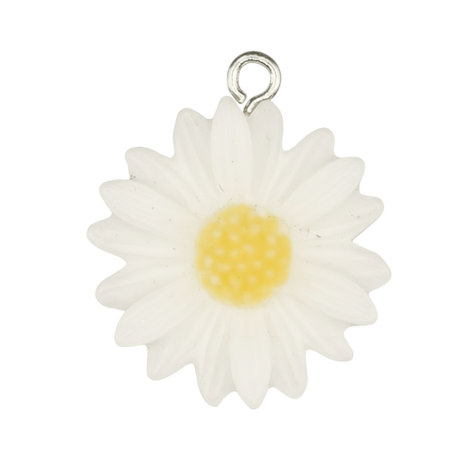 close-up of a white daisy flower charm with a yellow center on a black background