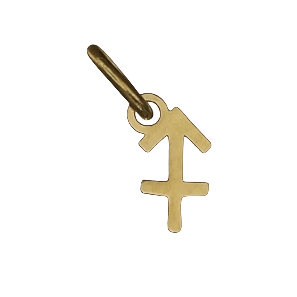 close-up of small gold Sagittarius symbol charm on black background