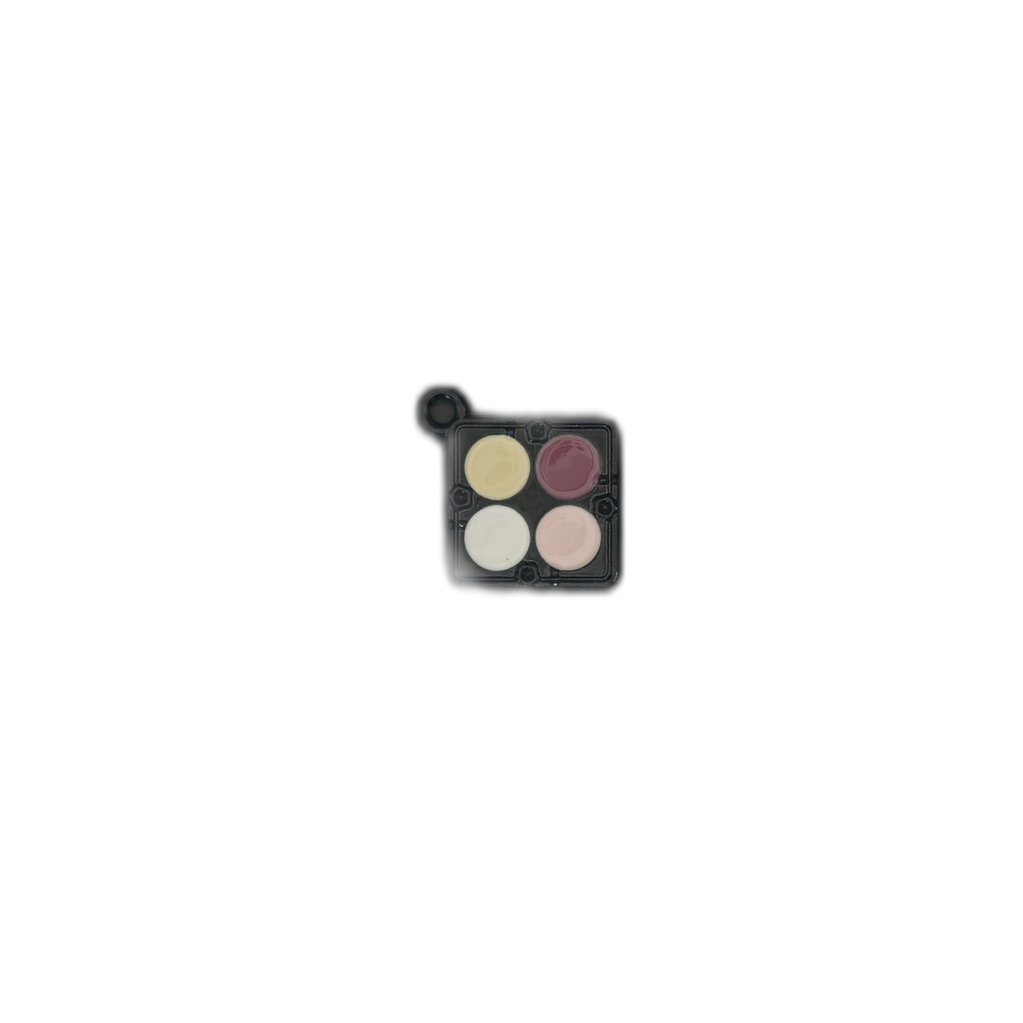 Small eyeshadow palette charm on a black background with yellow, mauve, white, and pink pans.
