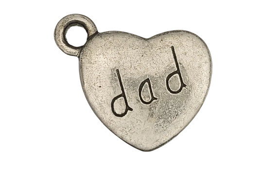 close-up silver heart charm with 'dad' text on black