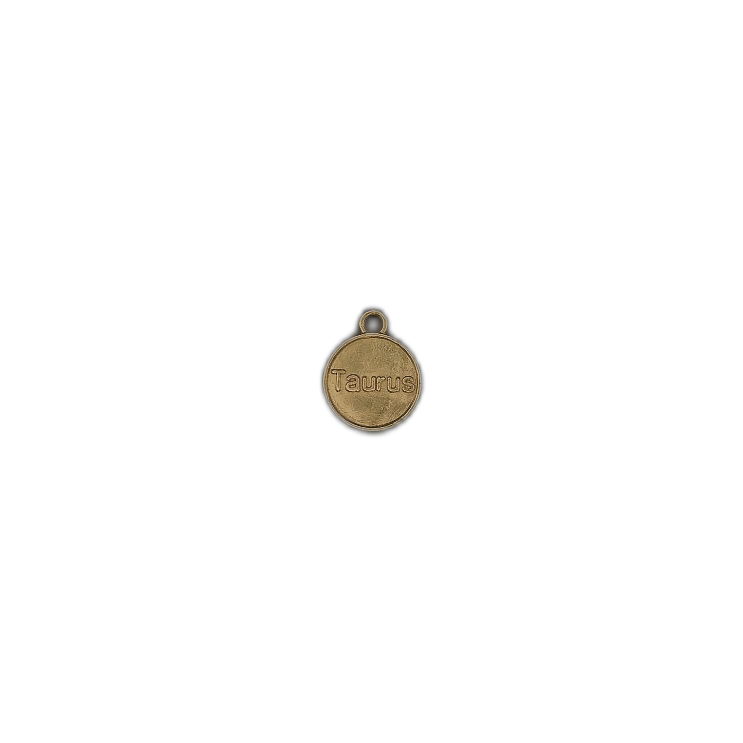 small gold-tone round 'Taurus' charm centered on a black background