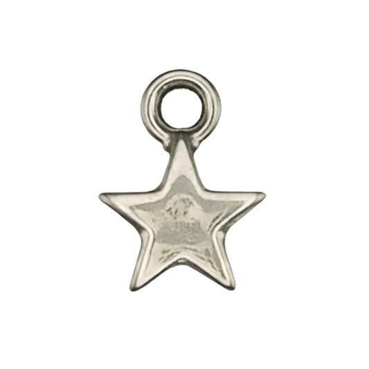 close-up of a small silver star-shaped charm on a black background