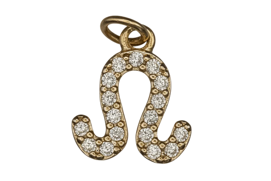 close-up of gold-tone pavé Leo zodiac charm on black background