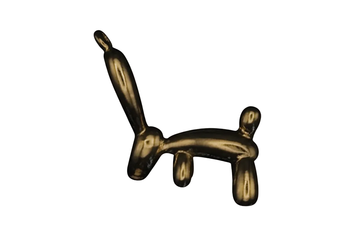 gold-tone rabbit-shaped charm on black background