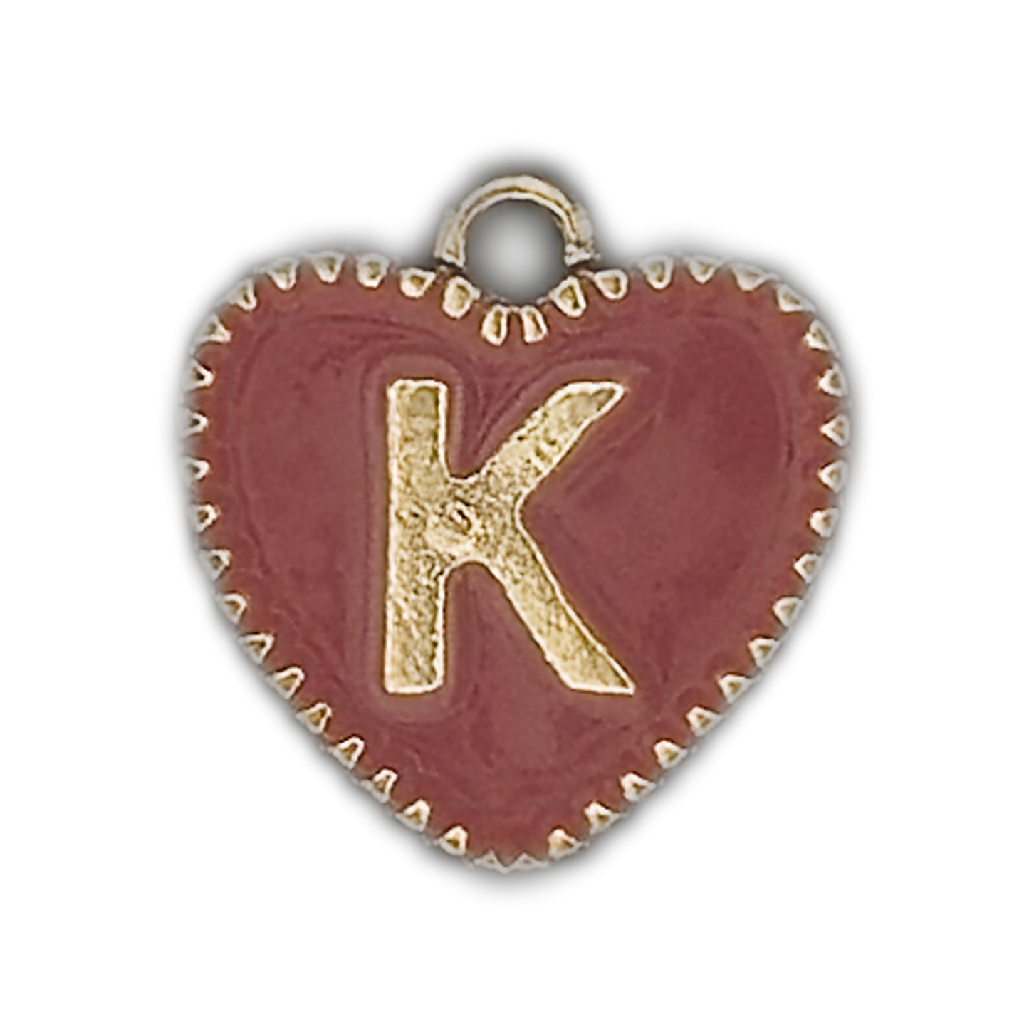 Close-up of a red heart charm with a gold letter K and dotted gold edge on a black background.