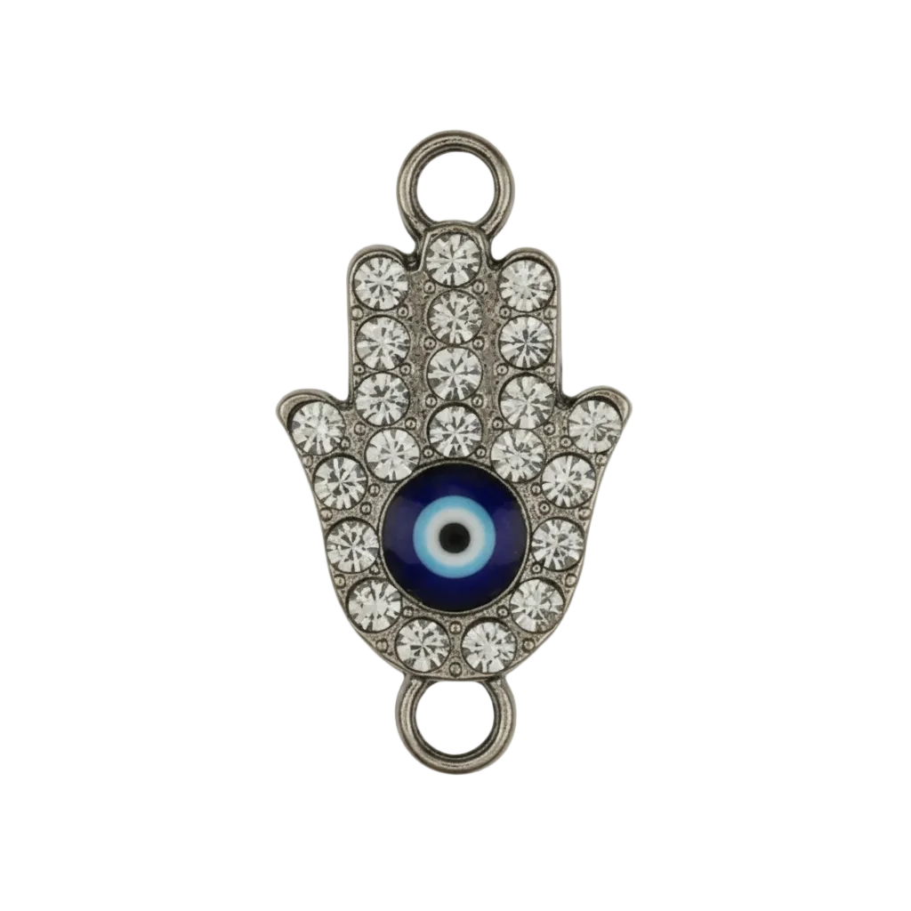 close-up of rhinestone hamsa hand charm with black-and-white eye on black background