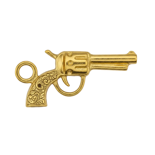 close-up of small gold-tone revolver charm