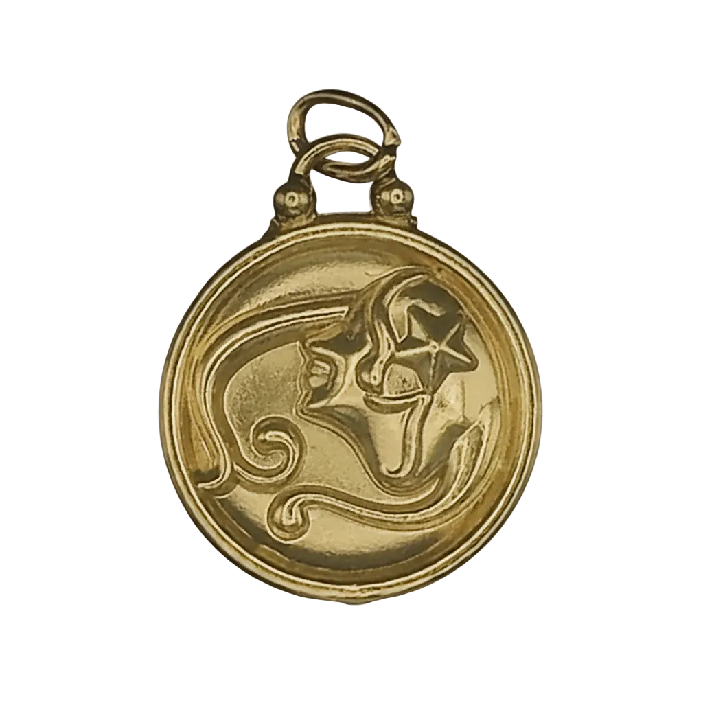 close-up of a round gold-tone charm with a raised face and star motif on black background