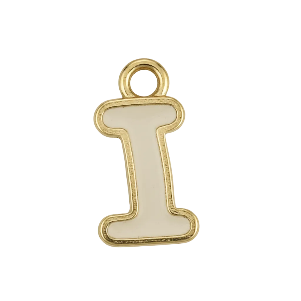 close-up of white enamel uppercase letter I charm with gold-tone outline on black background