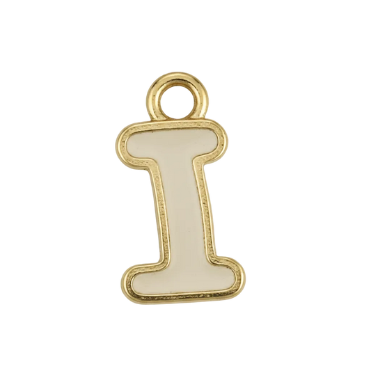 close-up of white enamel uppercase letter I charm with gold-tone outline on black background