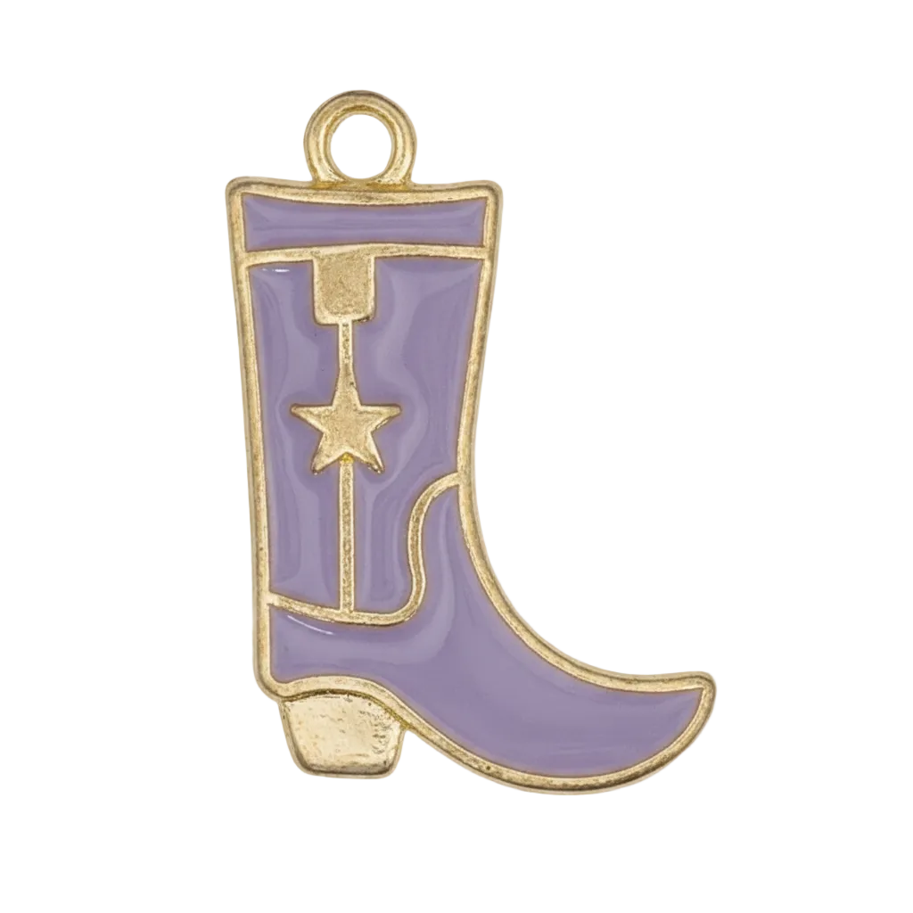 Close-up of a purple cowboy boot charm with gold-tone outline and star motif on a black background.