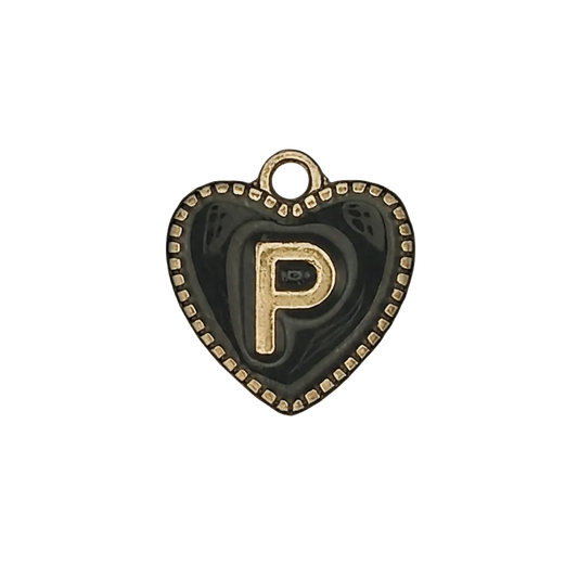Close-up of a black and gold heart charm with the letter P.