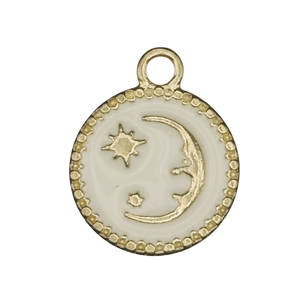close-up of round white charm with gold crescent moon and stars